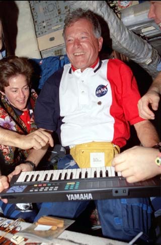 Chretien plays with a portable keyboard in the Base Block. 